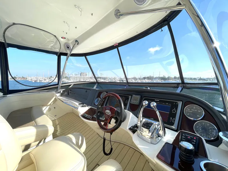 Slide: The Image of Luxurious 2012 Meridian 441 Sedan yacht cockpit with modern controls and panoramic views. - 46