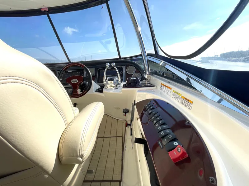 Slide: The Image of Interior view of 2012 Meridian 441 Sedan yacht cockpit with steering wheel and controls. - 48