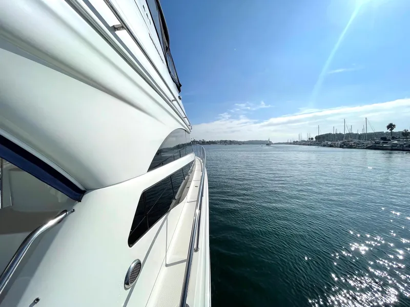 Slide: The Image of 2012 Meridian 441 Sedan yacht cruising on a sunny day, calm waters, clear blue sky. - 6