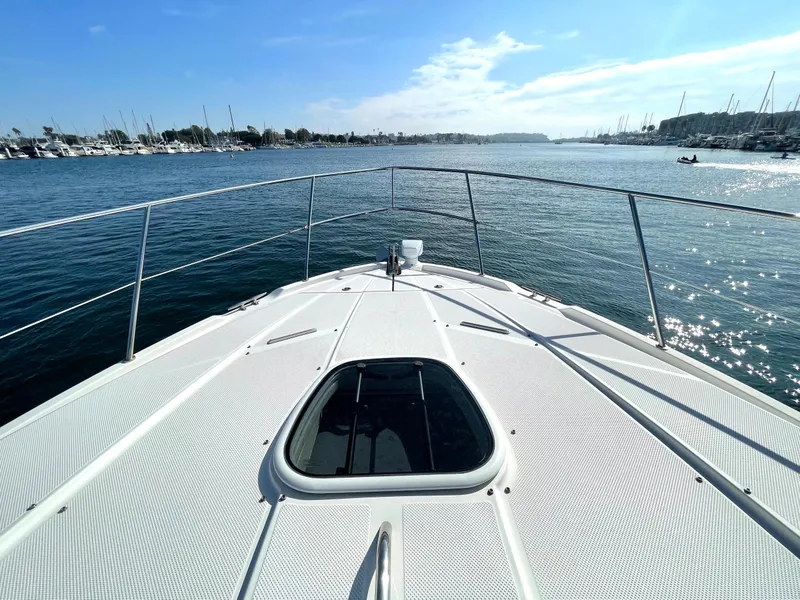 Slide: The Image of Bow view of 2012 Meridian 441 Sedan yacht on calm waters. - 7