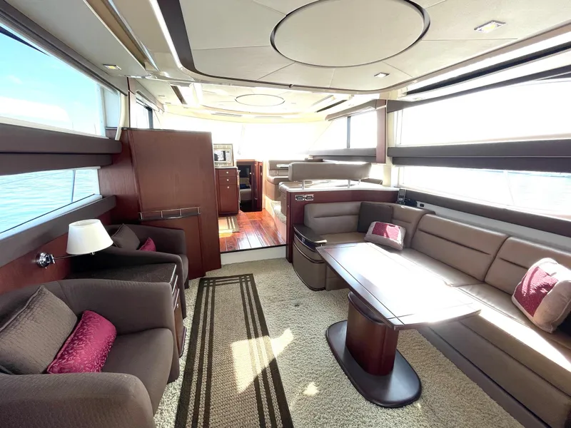 Slide: The Image of Luxurious interior of a 2012 Meridian 441 Sedan yacht with elegant seating and modern design. - 9