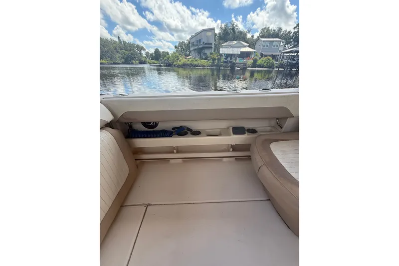 Slide: The Image of 2014 Grady-White Freedom 275 boat interior with scenic waterfront view. - 20