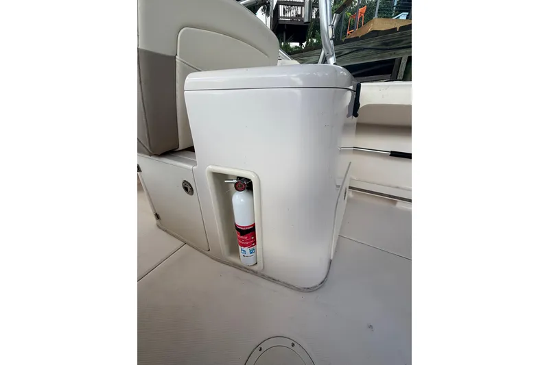 Slide: The Image of 2014 Grady-White Freedom 275 boat interior with fire extinguisher storage. - 24