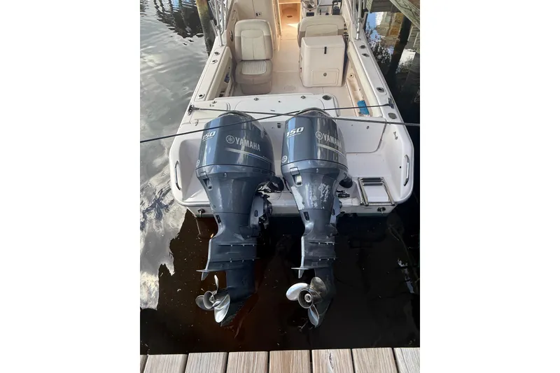 Slide: The Image of 2014 Grady-White Freedom 275 boat with twin Yamaha outboard engines docked. - 3