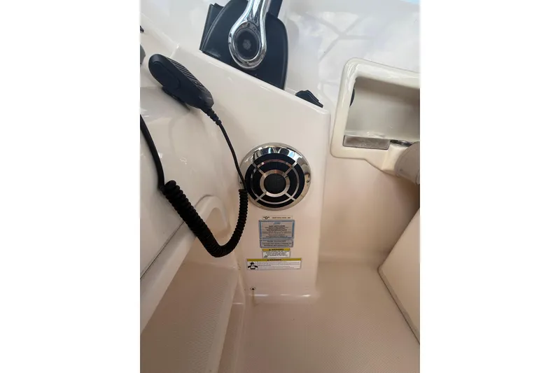 Slide: The Image of 2014 Grady-White Freedom 275 boat interior with speaker and microphone. - 33