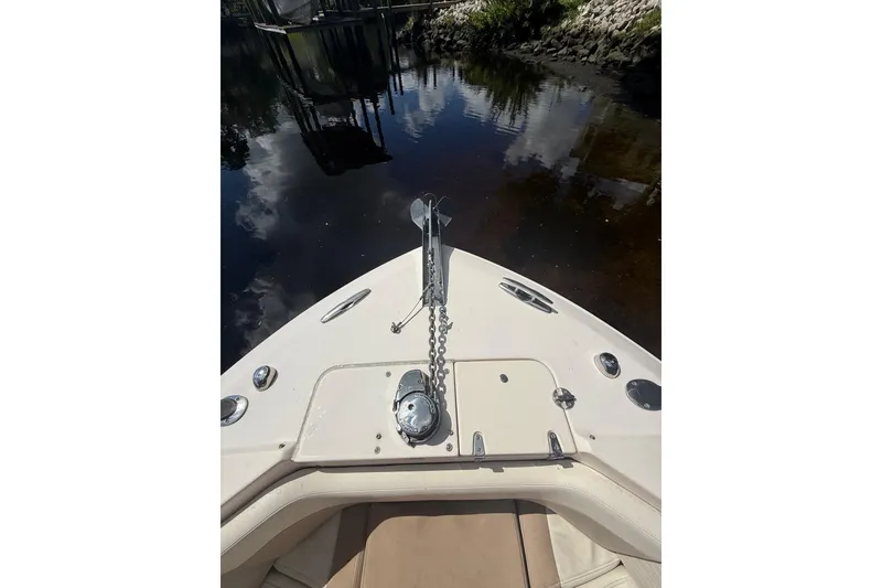 Slide: The Image of Bow view of 2014 Grady-White Freedom 275 boat with anchor chain and calm water. - 45