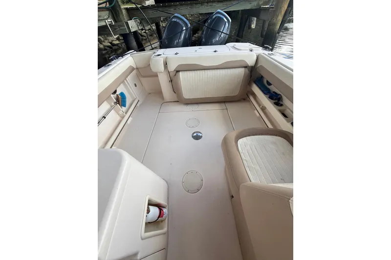 Slide: The Image of 2014 Grady-White Freedom 275 boat interior with seating and storage compartments. - 58
