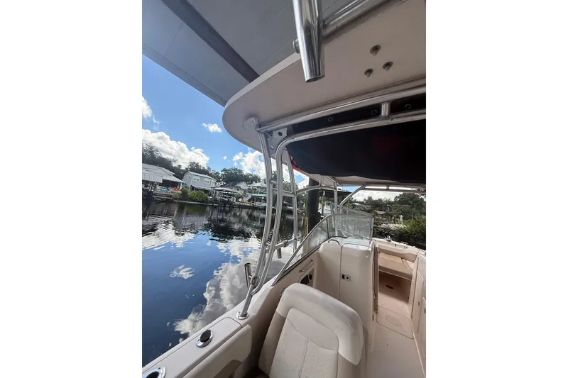 Slide: The Image of 2014 Grady-White Freedom 275 boat interior with scenic waterfront view. - 65