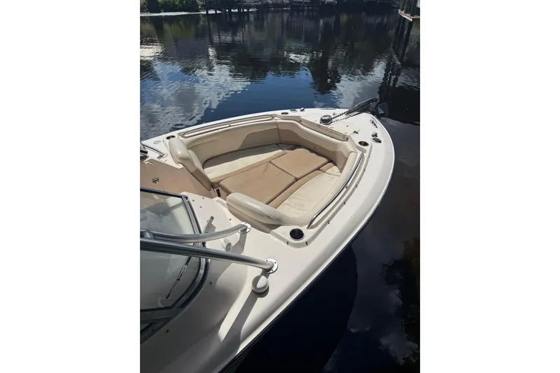 Slide: The Image of 2014 Grady-White Freedom 275 boat with spacious bow seating on calm water. - 8