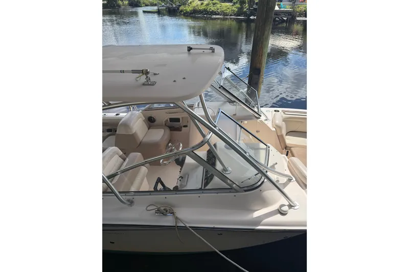 Slide: The Image of 2014 Grady-White Freedom 275 boat interior with seating and open windshield. - 9