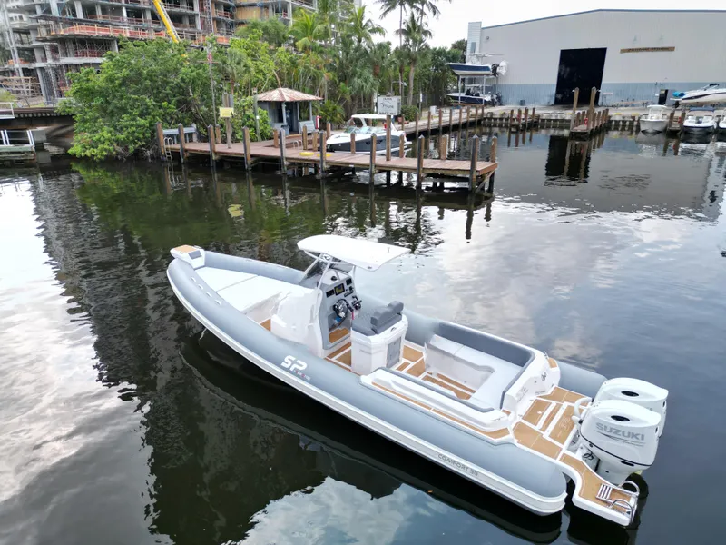 Slide: The Image of 2024 Sea Prop COMFORT 30 boat docked in a marina. - 3