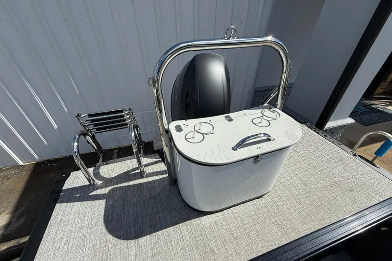 Slide: The Image of 2026 Tahoe Pontoon LTZ Quad Lounger with stainless steel ladder and storage compartment. - 15