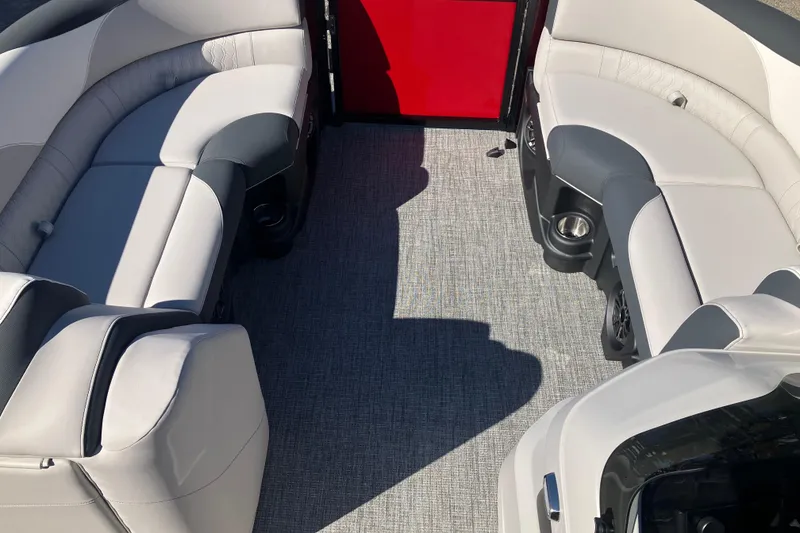 Slide: The Image of 2026 Tahoe Pontoon LTZ Quad Lounger interior with plush seating and modern design. - 21