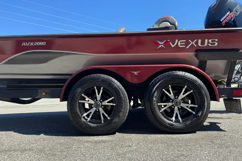 Slide: The Image of 2019 Vexus AVX2080 boat with dual wheels, red and gray design. - 6