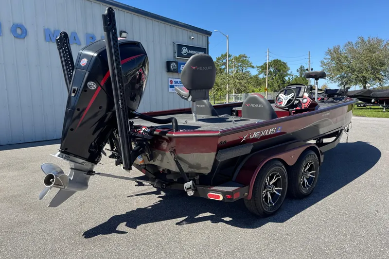 Slide: The Image of 2019 Vexus AVX2080 boat with outboard motor, parked outdoors on a sunny day. - 9