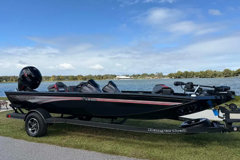 The Image of 2025 Ranger RT198P boat on trailer by a scenic lake. - 0