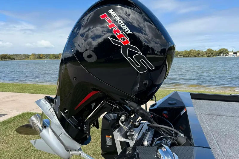 Slide: The Image of 2025 Ranger RT198P boat with Mercury Pro XS engine by a lake. - 7