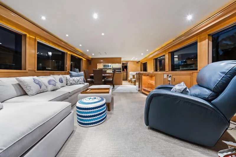 Slide: The Image of Luxurious interior of 2000 Hatteras 74 Cockpit Motor Yacht with plush seating and elegant decor. - 3