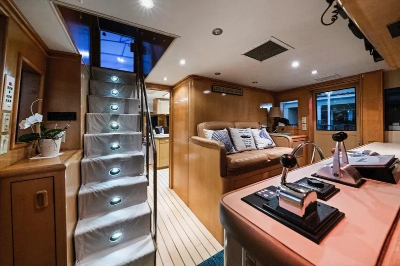 Slide: The Image of Luxurious interior of 2000 Hatteras 74 Cockpit Motor Yacht with elegant lighting and cozy seating. - 31