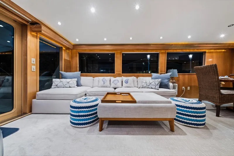 Slide: The Image of Luxurious interior of 2000 Hatteras 74 Cockpit Motor Yacht with elegant seating and decor. - 41
