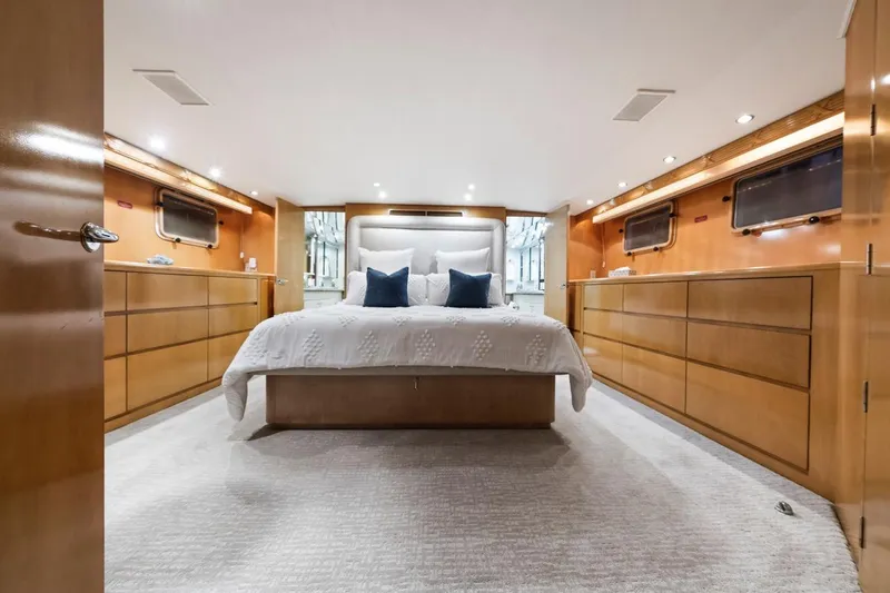 Slide: The Image of Luxurious bedroom interior of 2000 Hatteras 74 Cockpit Motor Yacht with elegant wood finish. - 43