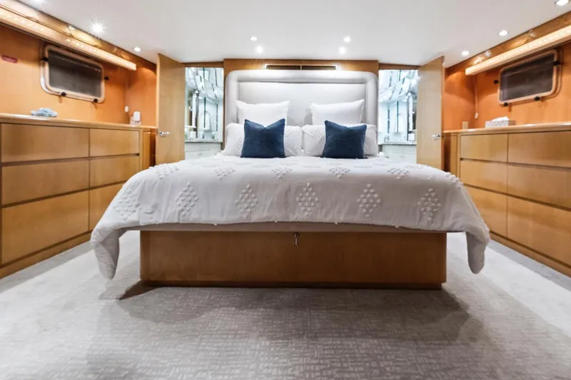 Slide: The Image of Luxurious bedroom interior of 2000 Hatteras 74 Cockpit Motor Yacht with elegant bedding. - 44