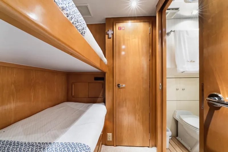 Slide: The Image of Interior of 2000 Hatteras 74 Cockpit Motor Yacht with bunk beds and bathroom. - 49