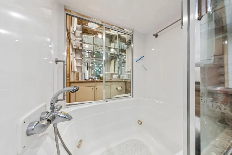 Slide: The Image of Luxurious bathroom in 2000 Hatteras 74 Cockpit Motor Yacht with modern fixtures. - 59