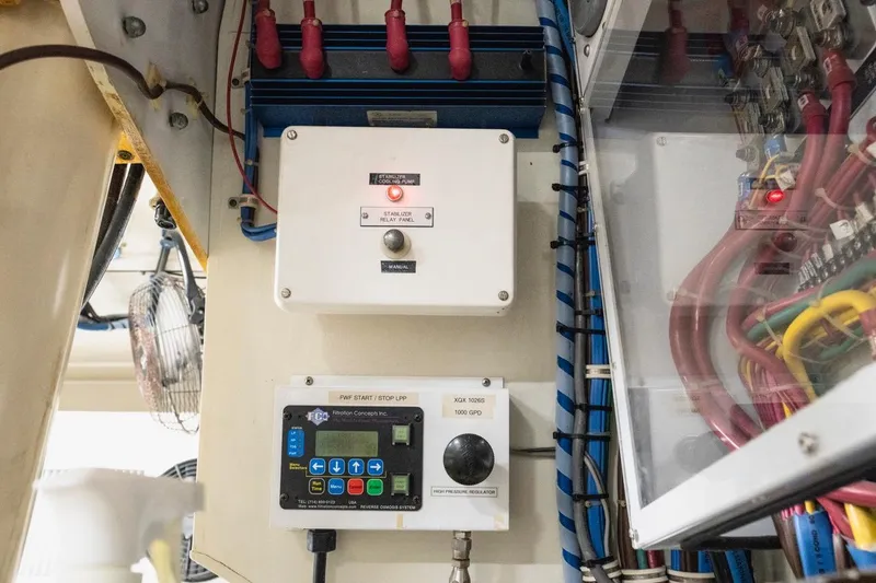 Slide: The Image of Electrical control panel in a 2000 Hatteras 74 Cockpit Motor Yacht engine room. - 70