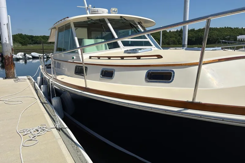 Slide: The Image of 2004 Bruckmann Bluestar 38 docked, showcasing sleek design and polished exterior. - 54