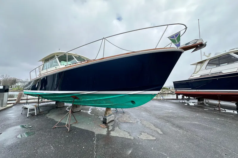 Slide: The Image of 2004 Bruckmann Bluestar 38 boat on dry dock, overcast sky background. - 15