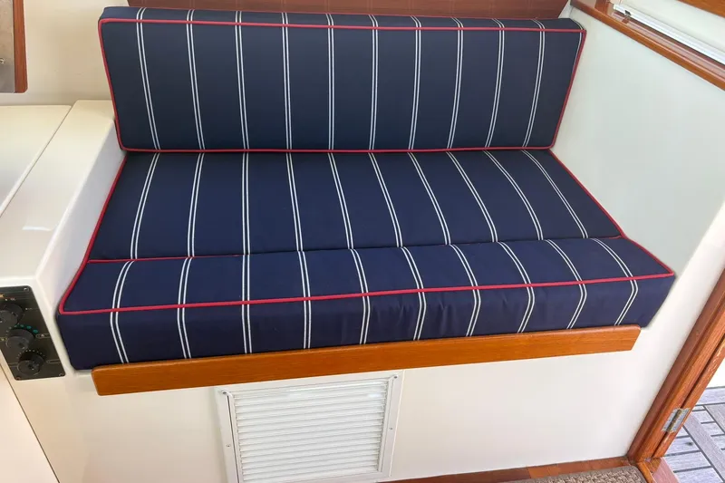 Slide: The Image of Navy striped seating with red trim on 2004 Bruckmann Bluestar 38 boat. - 43