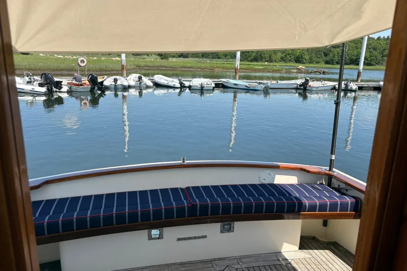 Slide: The Image of Bruckmann Bluestar 38 yacht, 2004 model, docked with scenic waterfront view. - 52