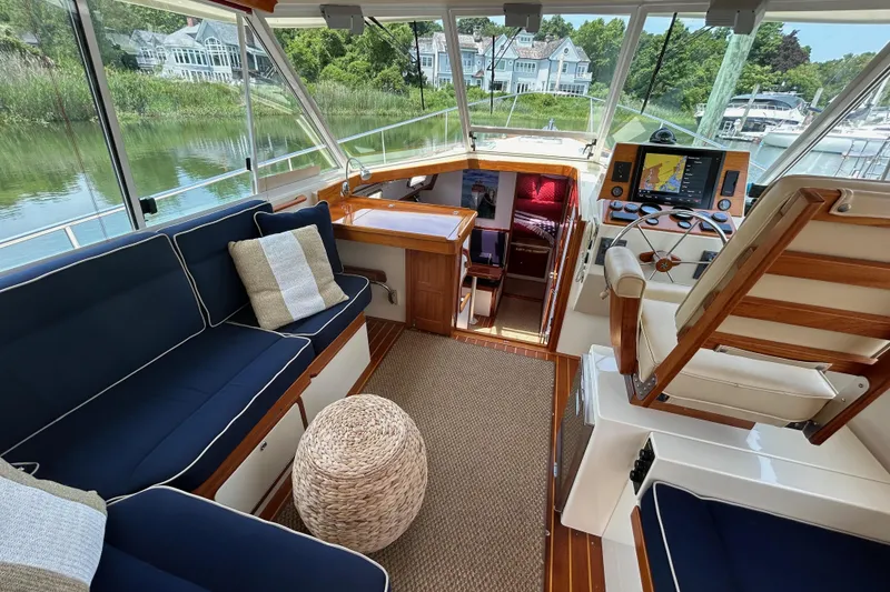 Slide: The Image of Interior of 2004 Bruckmann Bluestar 38 yacht with seating and navigation area. - 24