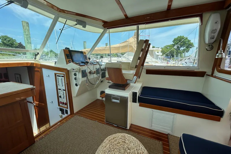 Slide: The Image of Interior of 2004 Bruckmann Bluestar 38 yacht with helm, seating, and navigation equipment. - 25