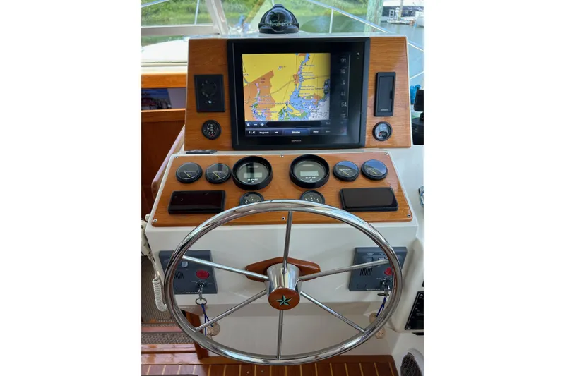 Slide: The Image of Helm of 2004 Bruckmann Bluestar 38 with navigation display and gauges. - 27