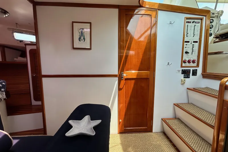 Slide: The Image of Interior of 2004 Bruckmann Bluestar 38 yacht with wooden door and control panel. - 37