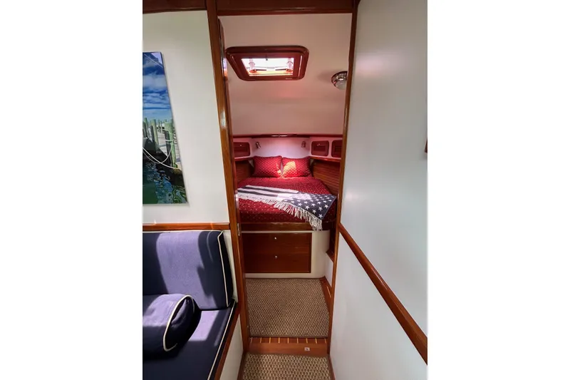 Slide: The Image of Cozy cabin interior of 2004 Bruckmann Bluestar 38 yacht with bed and seating area. - 41