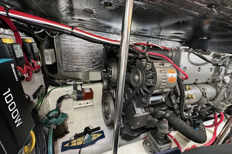 Slide: The Image of Engine room of a 2004 Bruckmann Bluestar 38, showcasing mechanical components and wiring. - 51