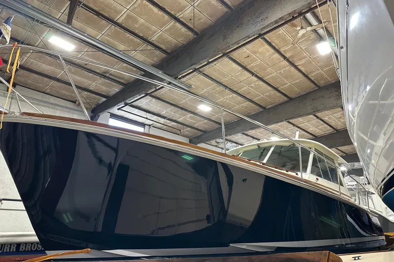 Slide: The Image of 2004 Bruckmann Bluestar 38 yacht in a boatyard, under indoor lighting. - 7