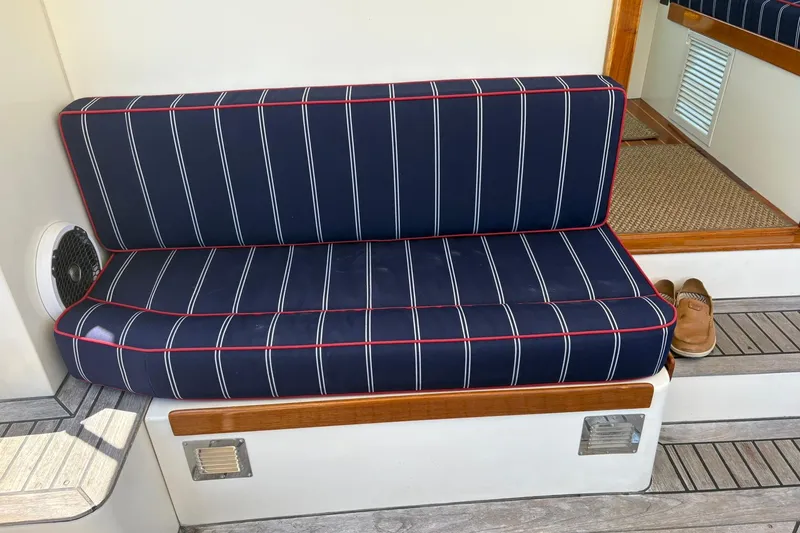 Slide: The Image of Blue striped bench seat on 2004 Bruckmann Bluestar 38 boat deck. - 50