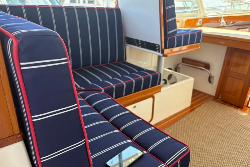 Slide: The Image of Interior of 2004 Bruckmann Bluestar 38 with striped navy seating and wooden accents. - 51