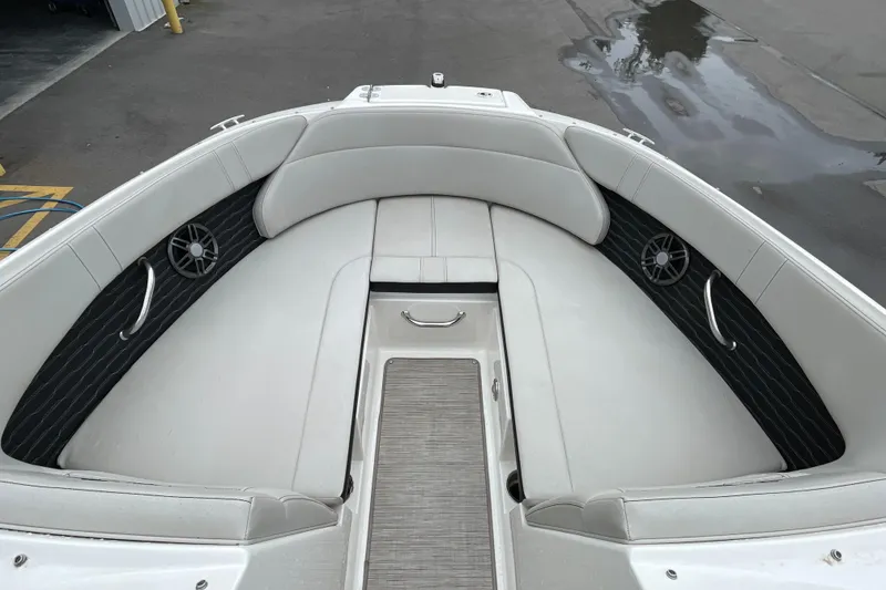 Slide: The Image of 2023 Sea Ray SPX 230 boat interior with white seating and sleek design. - 6