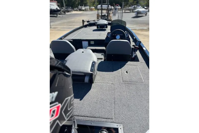 Slide: The Image of 2025 Lowe Stinger 195 Bass boat interior with seating and control panel. - 3
