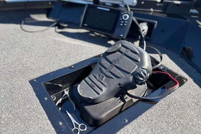 Slide: The Image of Foot pedal control on 2025 Lowe Stinger 195 Bass boat deck with navigation equipment. - 4