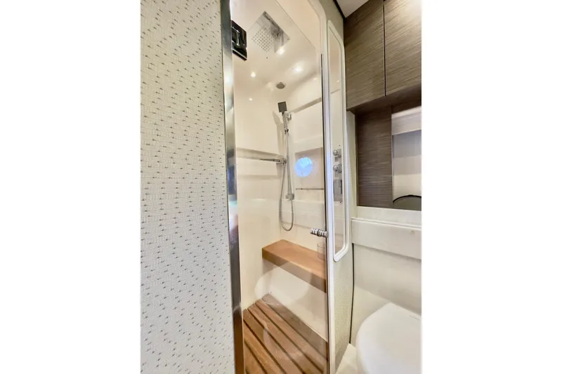 Slide: The Image of Luxurious shower in 2020 Tiara Yachts F53 Flybridge, featuring modern fixtures and wooden accents. - 16