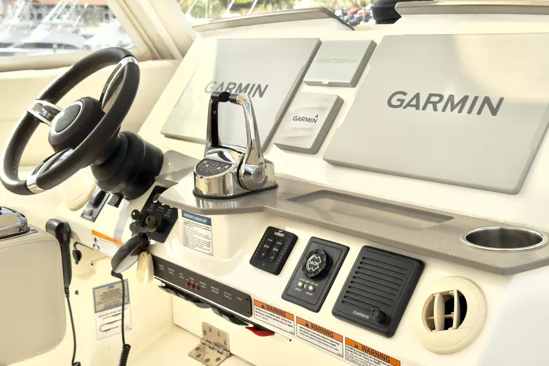 Slide: The Image of Helm of 2020 Tiara Yachts F53 Flybridge with Garmin navigation system. - 25