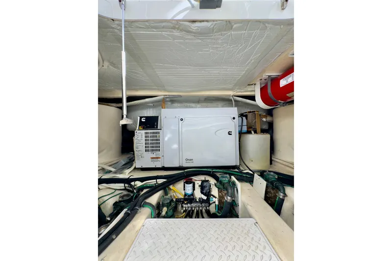 Slide: The Image of Engine room of 2020 Tiara Yachts F53 Flybridge with Onan generator. - 28