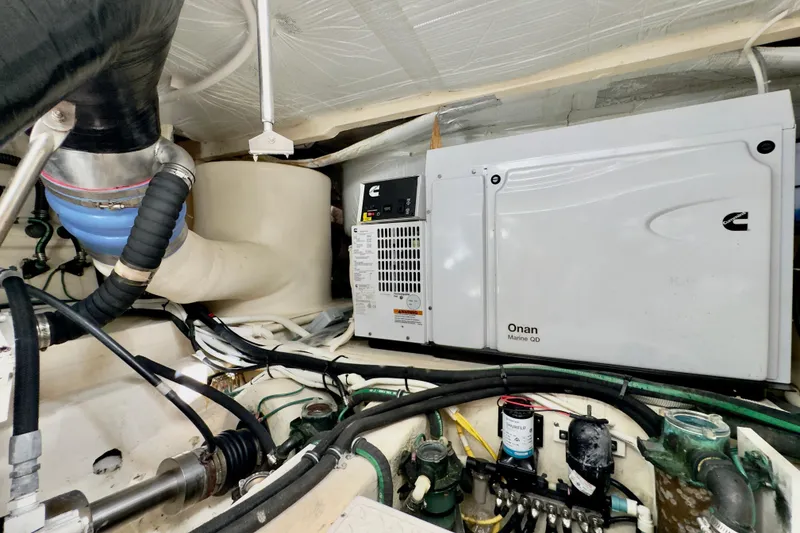 Slide: The Image of Engine room of 2020 Tiara Yachts F53 Flybridge with Onan Marine generator. - 29