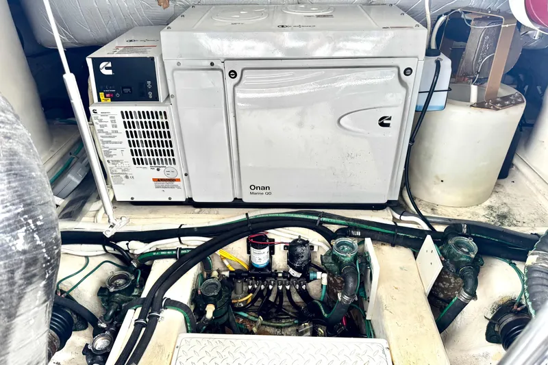 Slide: The Image of Engine room of 2020 Tiara Yachts F53 Flybridge with Onan Marine generator. - 30
